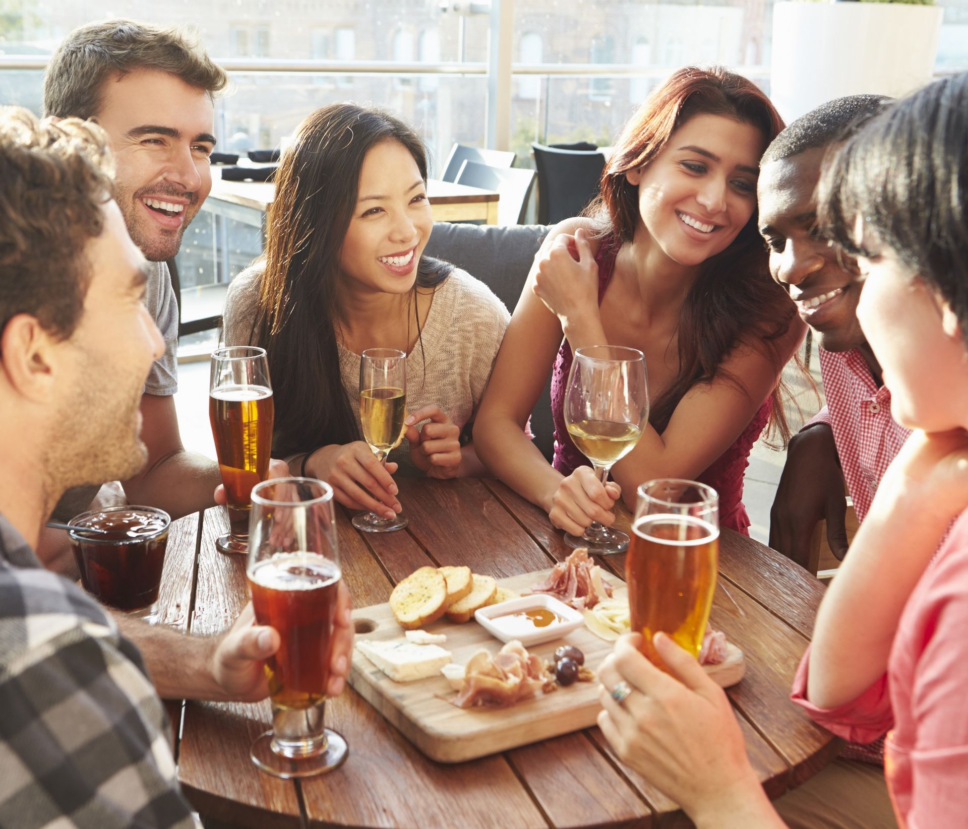 people enjoying beer and cheese