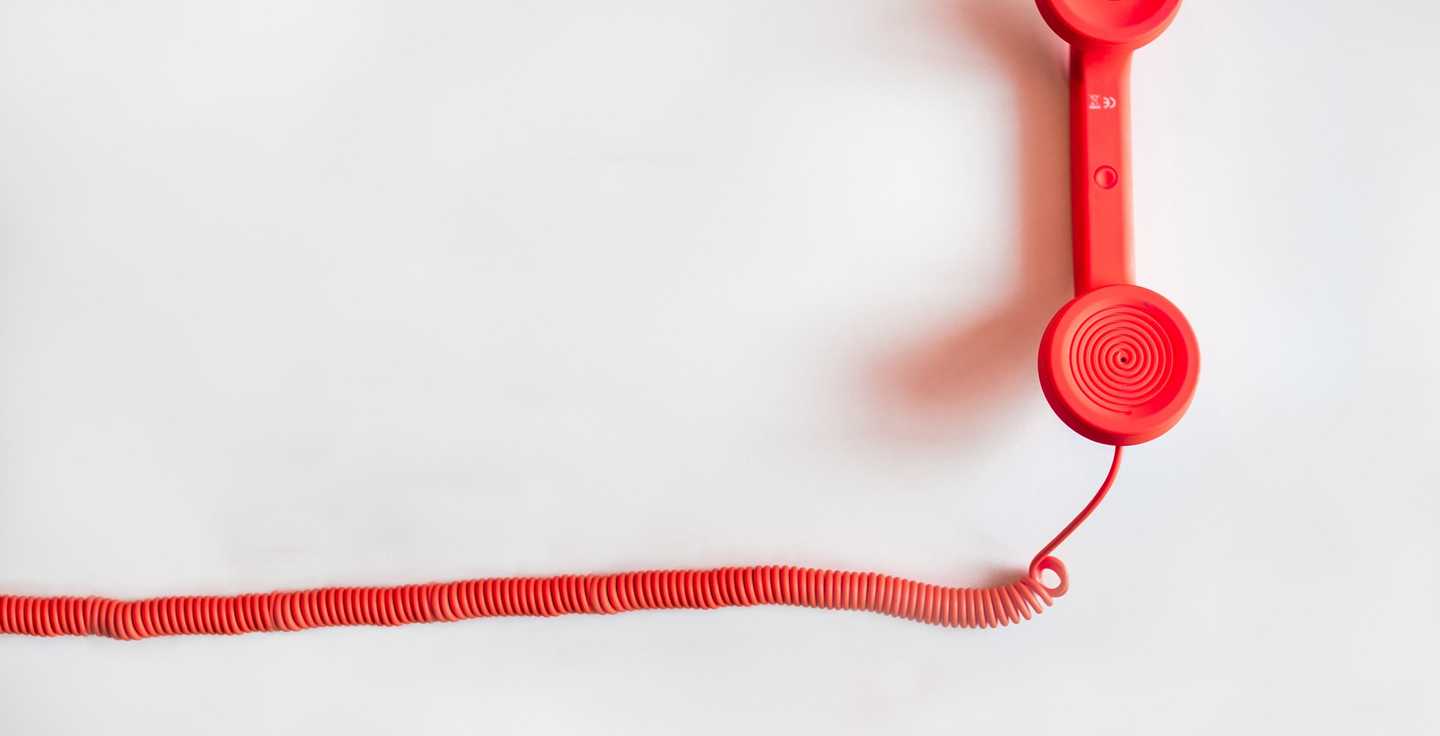 A red corded phone